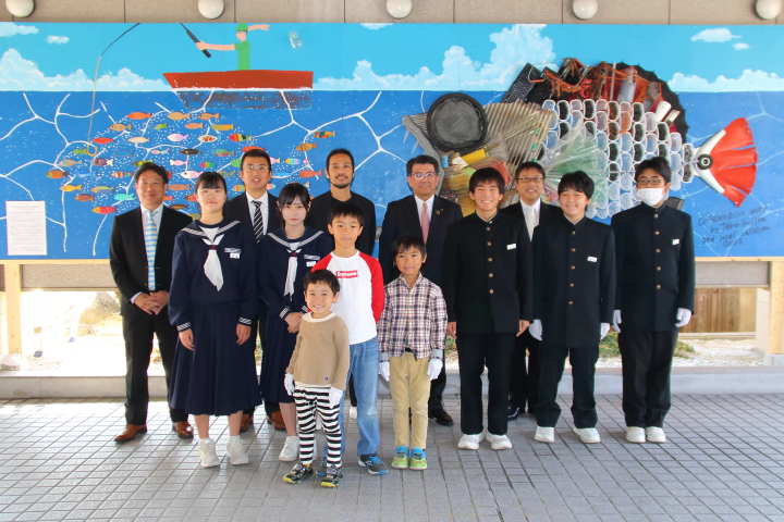 Group photo after the unveiling ceremony of the plastic waste art piece. 
