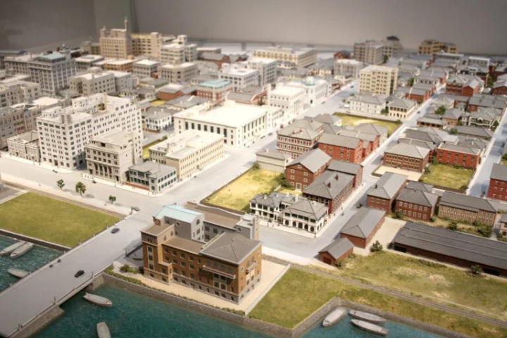 A diorama model that includes not only buildings but also people.