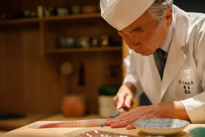 chef cutting fish