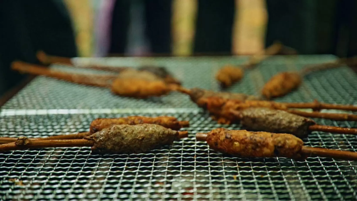 The game and vegetable skewers were grilled over charcoal and enjoyed piping hot. 
