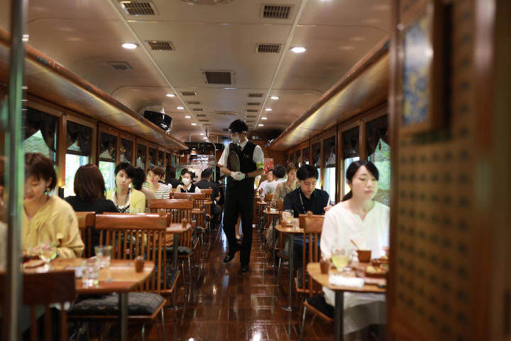 Dining experience on the Tango Kuromatsu (restaurant train) crossing the Yura River railway bridge
