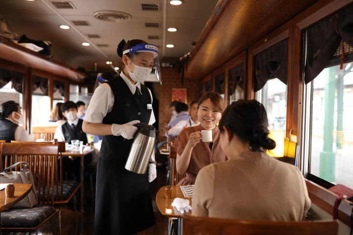 Dining experience on the Tango Kuromatsu (restaurant train) crossing the Yura River railway bridge