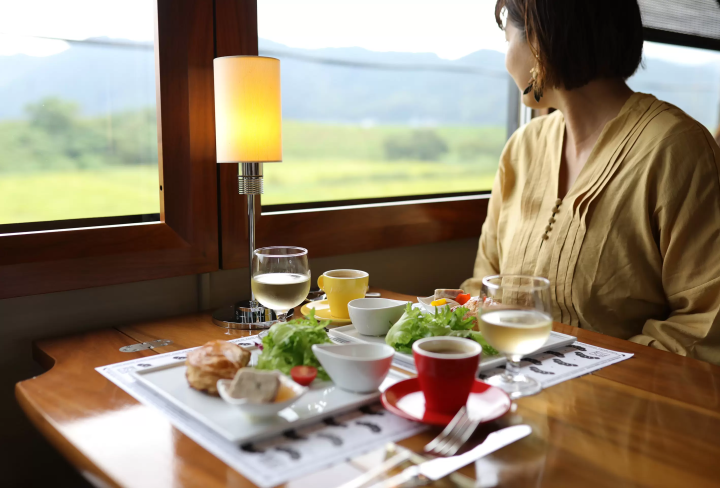 Dining experience on the Tango Kuromatsu (restaurant train) crossing the Yura River railway bridge