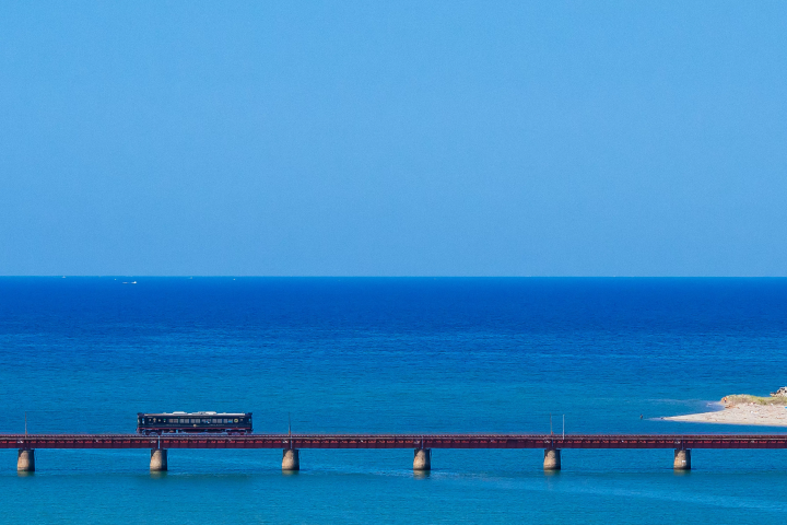 Dining experience on the Tango Kuromatsu (restaurant train) crossing the Yura River railway bridge