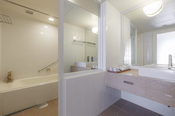 The spacious washroom space is equipped with a bathtub so you can relax in comfort. 