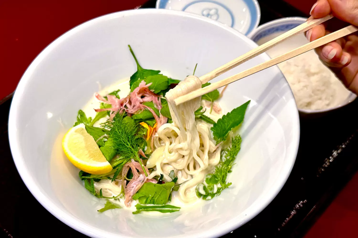 The "Oyster Mazesoba" is a masterpiece made with a creamy sauce made from the oil used to confit the local specialty oysters and minced turkey, garnished with refreshing herbs. 