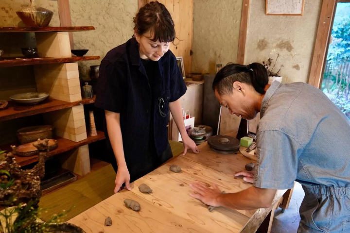 Kristina guided by Maeda-san in a hands-on workshop creating Awaji-Iga ware