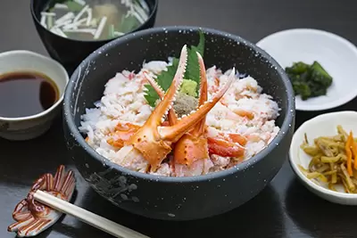 A generous crab bowl topped with sweet red snow crab meat and rich crab miso. 